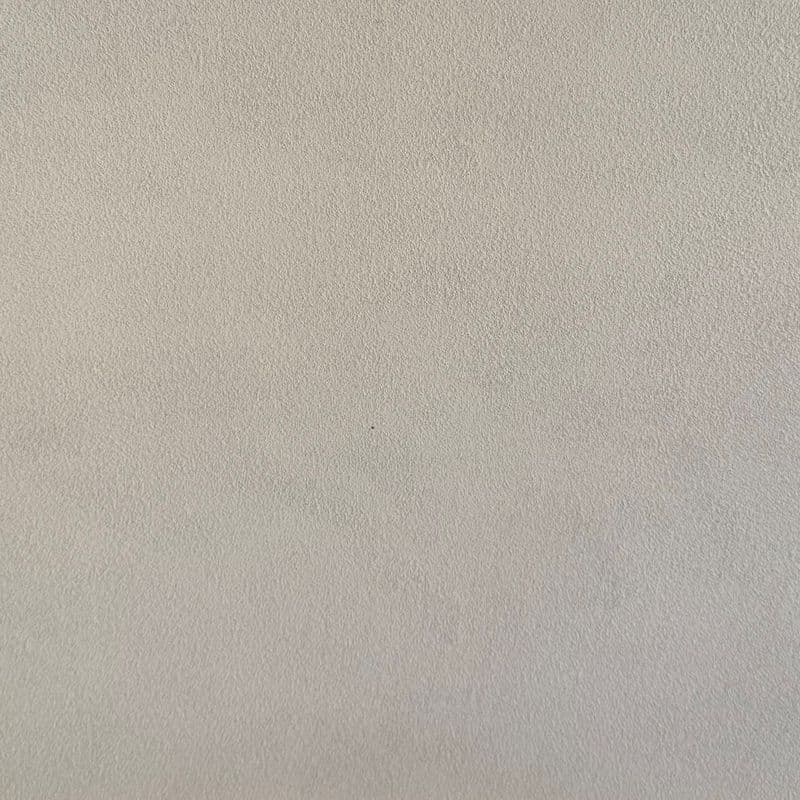 Een woonkamer met een lavavloer gietvloer.