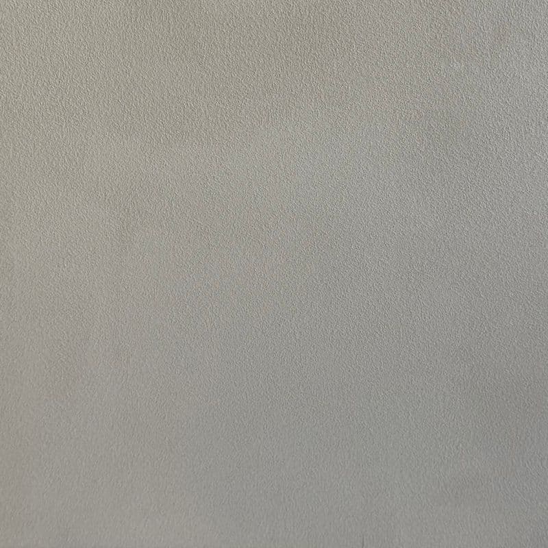 Een woonkamer met een lavavloer gietvloer.